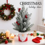 Flocked tabletop Christmas tree with berries