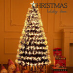 Green artificial Christmas tree with warm white fiber-optic lights